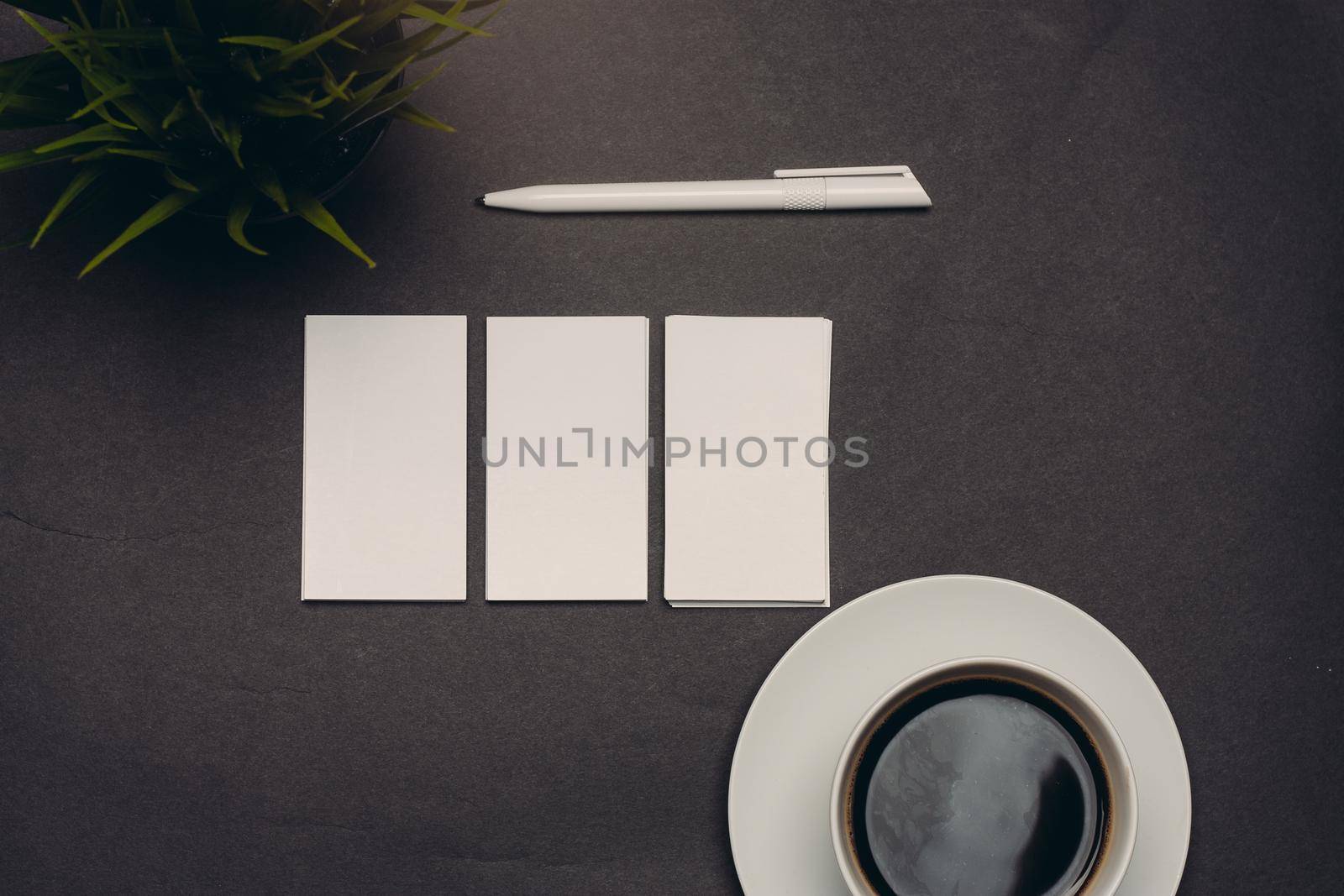 business cards on table and coffee cup pen top view by SHOTPRIME