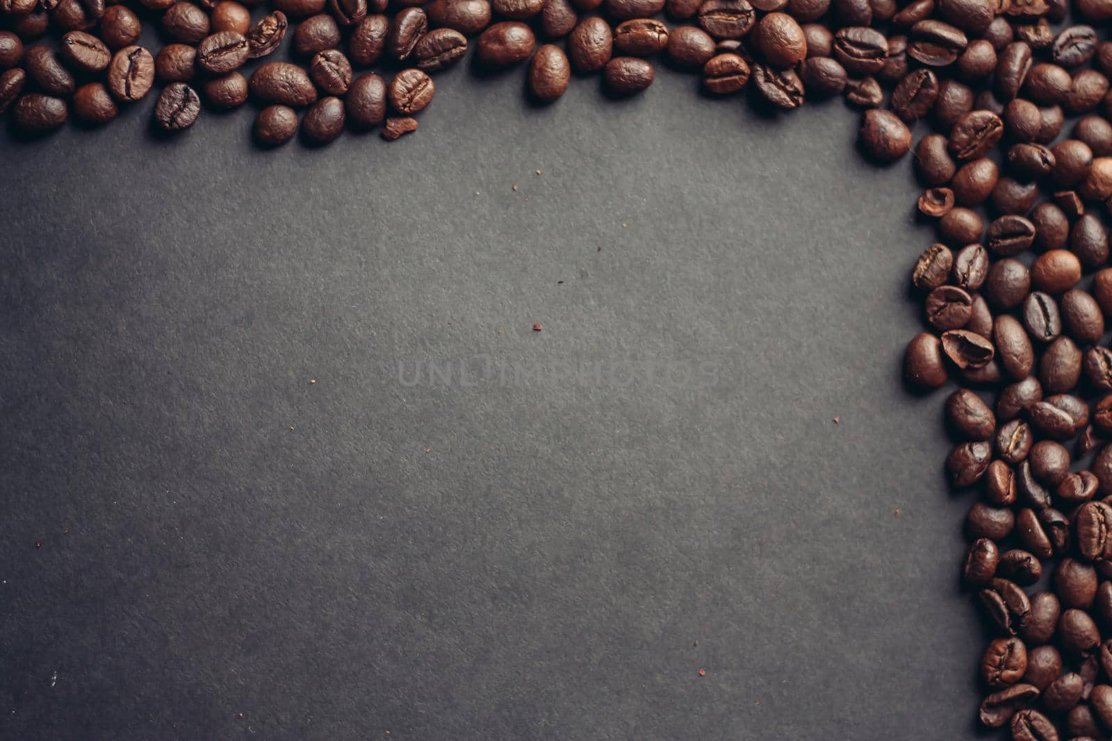roasted coffee beans on a gray background texture Copy Space. High quality photo