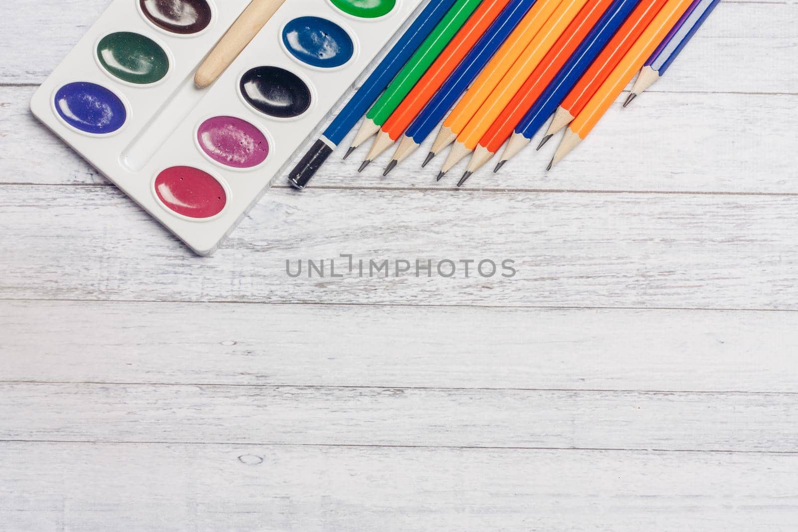 watercolor paint colored pencils wooden table art school drawing background image by SHOTPRIME