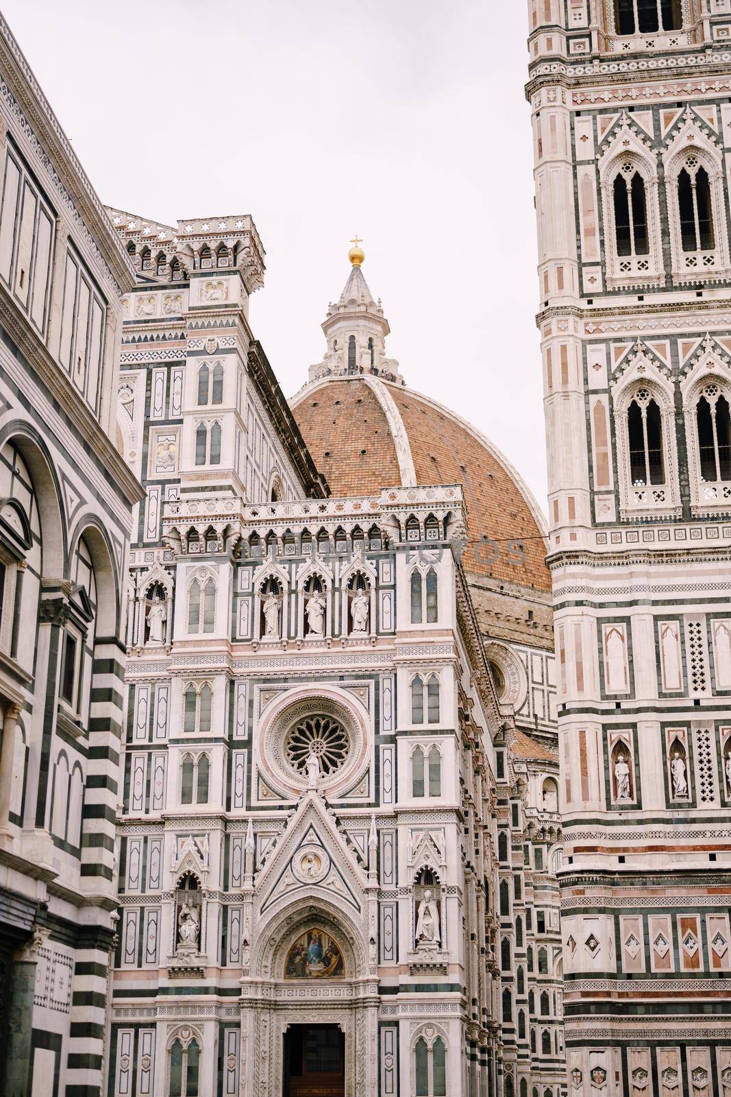 A close-up of the facade of the Santa Maria del Fiore building in Florence, Italy.