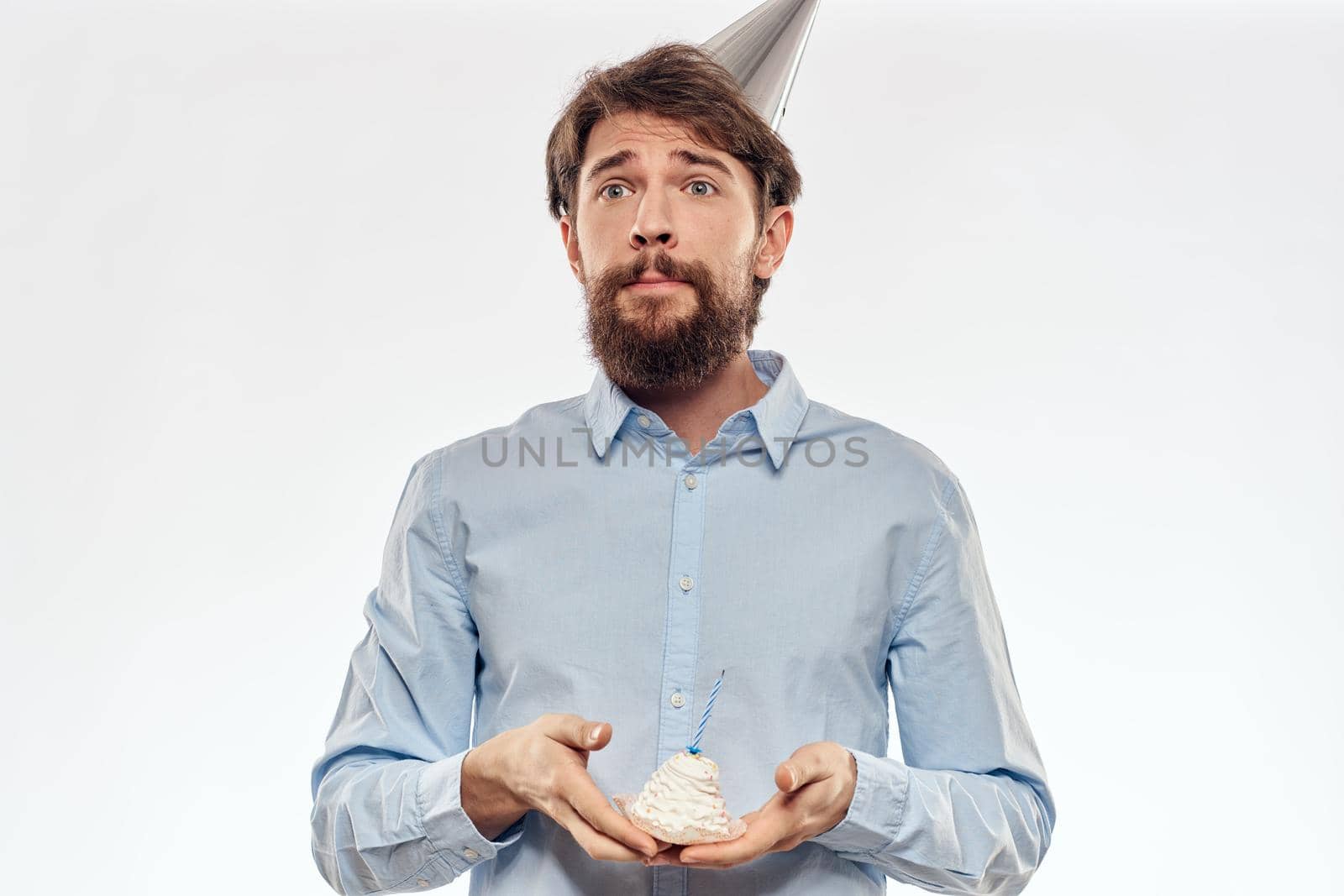 Happy guy with birthday cake white background Compact corporate party cropped beard view. High quality photo