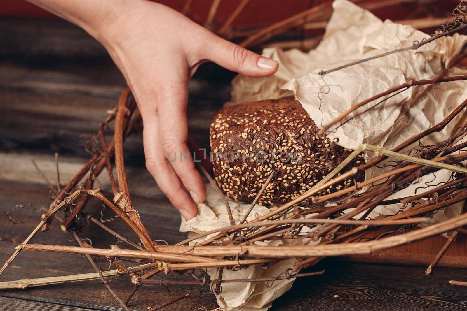 packed rye bread lies in a bird's nest on a red background. High quality photo