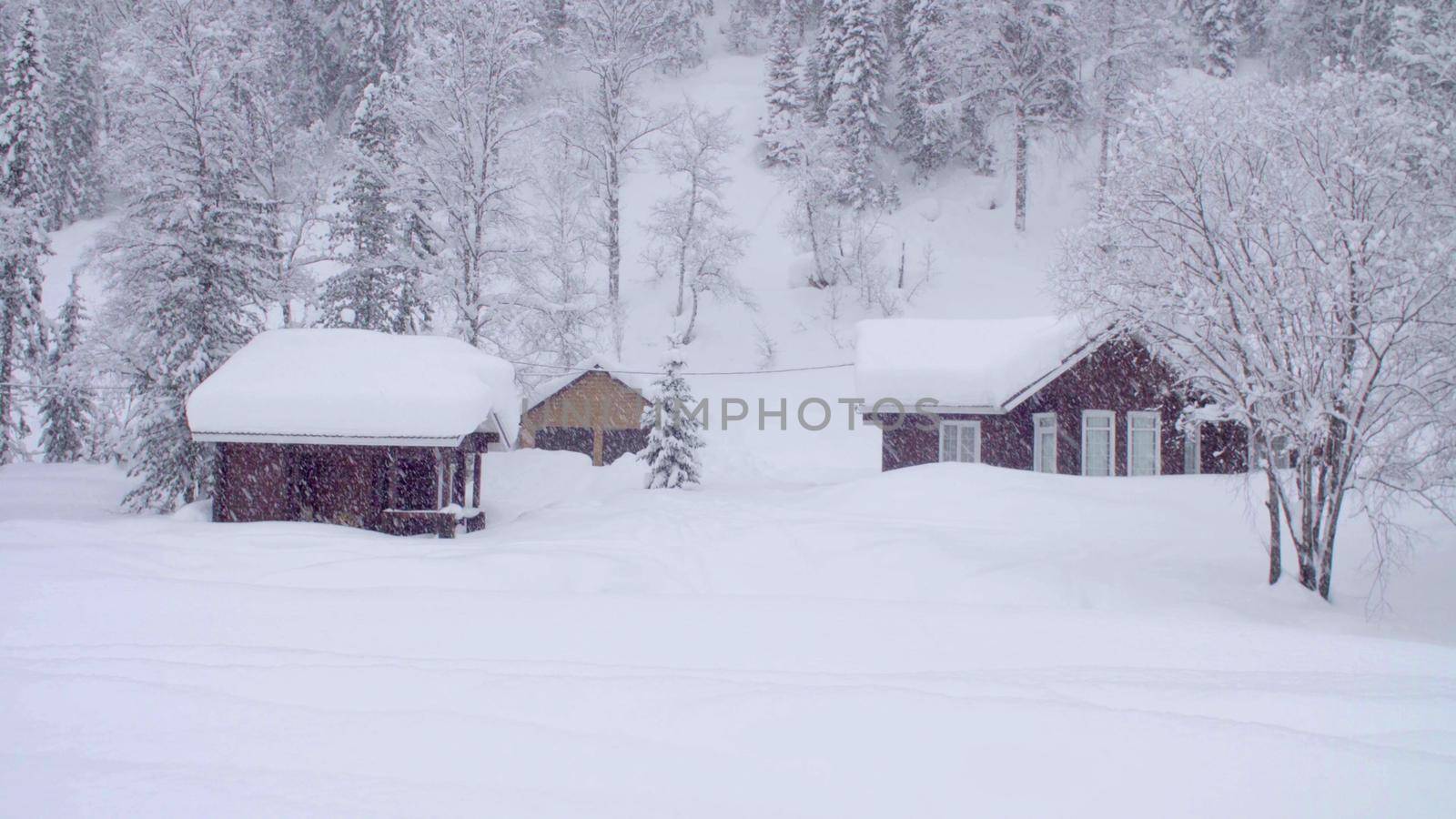 Snowfall in the skitouring lodge in Siberia by Chudakov