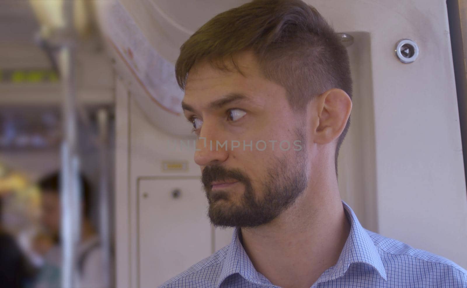 Portrait of a man in the subway train by Chudakov