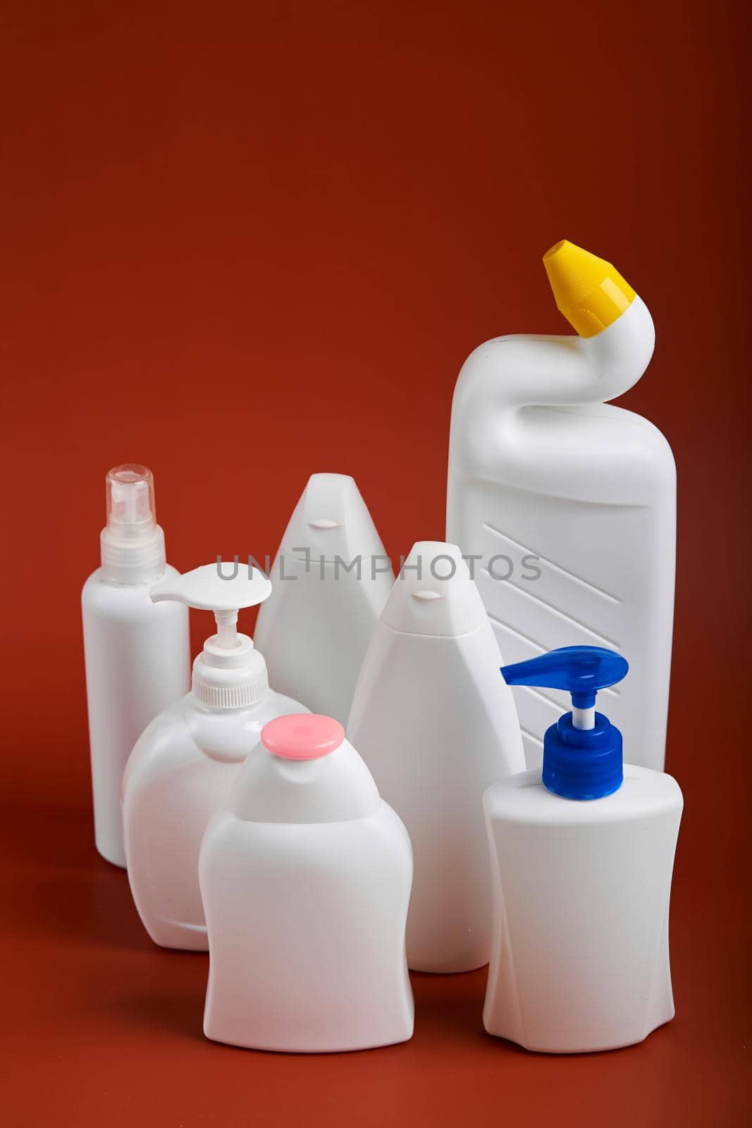 A various shapes blank white plastic bottles of soap products.