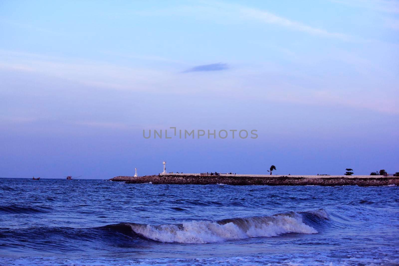 The landscape of the ocean waves at Narathatat Beach, Narathiwat Province.