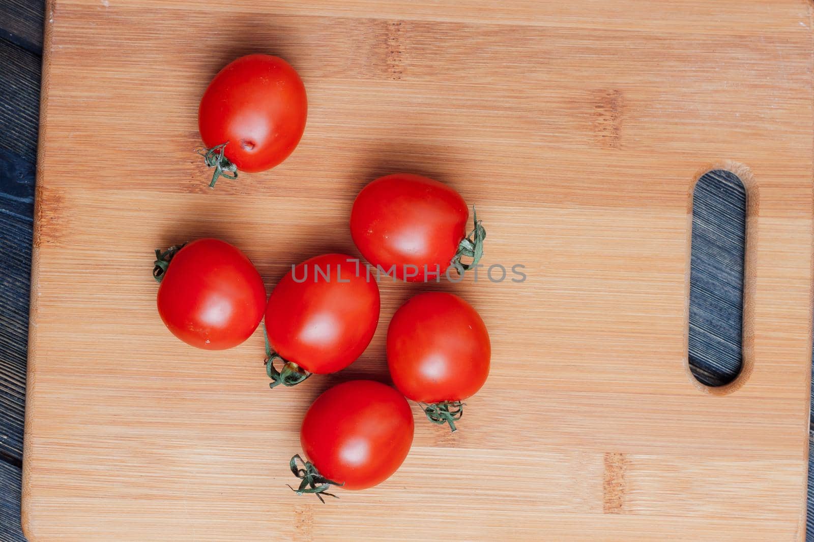 pasta on the kitchen table cherry tomatoes ingredients cooking italian. High quality photo