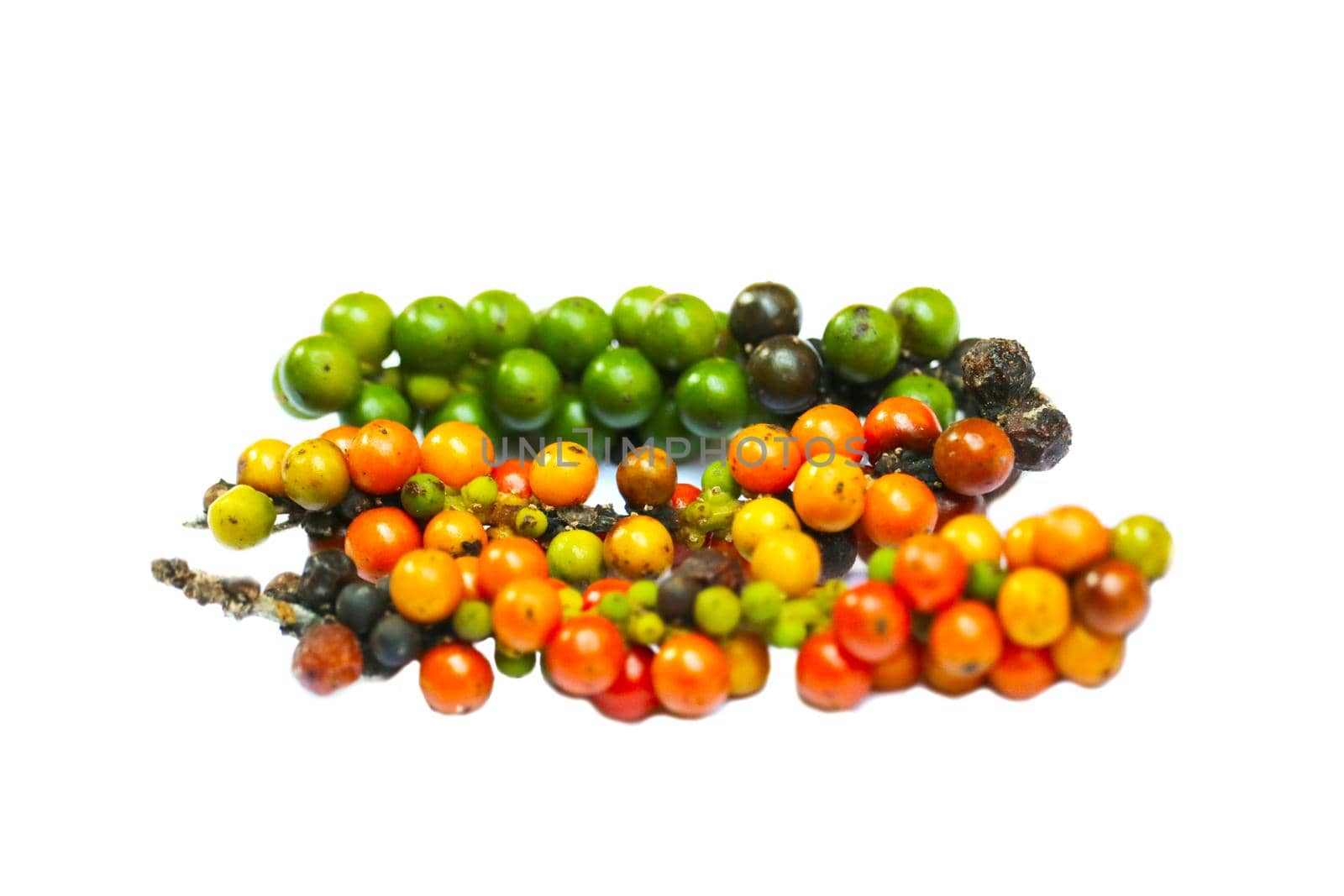 Heap of multicolor raw pepper isolated on white background by Darkfox