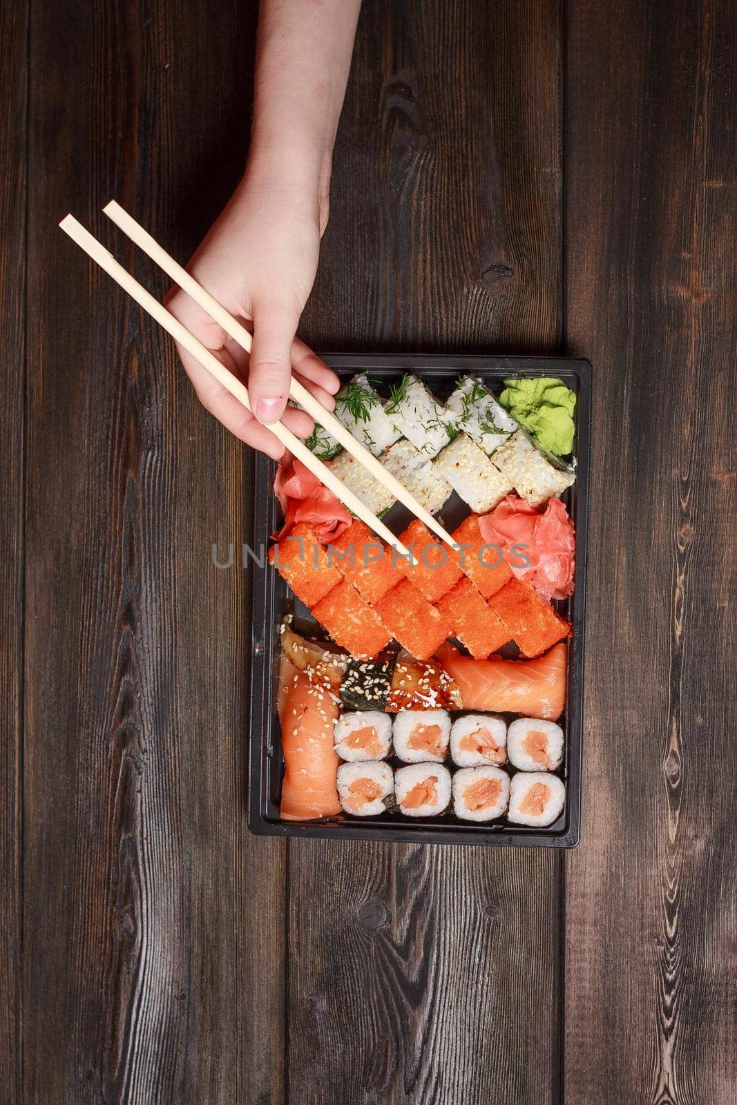 ginger seafood wooden table sushi and rolls delicacy. High quality photo