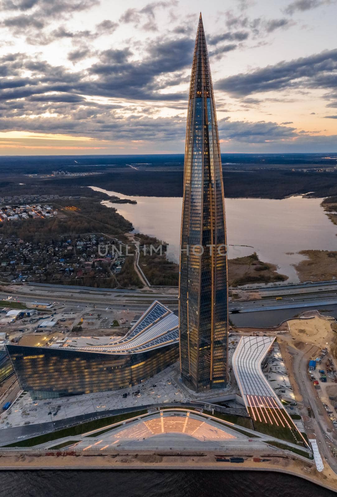 Russia, St.Petersburg, 06 May 2020: Aerial panoramic image of skyscraper Lakhta center at sunset, night illumination is on, It is the highest skyscraper in Europe, Completion of construction, dusk