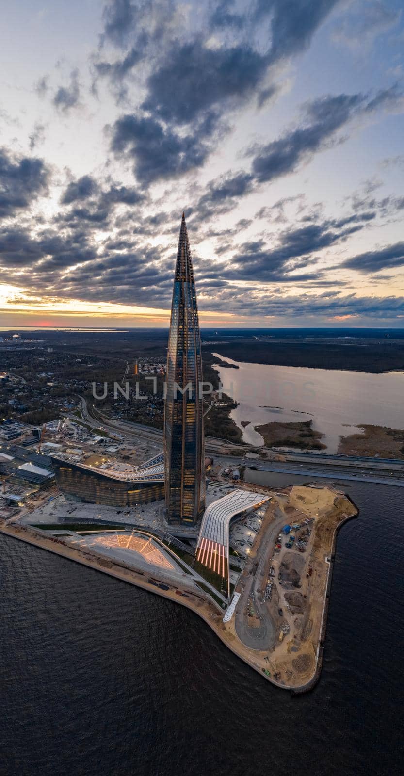 Russia, St.Petersburg, 06 May 2020: Aerial panoramic image of skyscraper Lakhta center at sunset, night illumination is on, It is the highest skyscraper in Europe, Completion of construction by vladimirdrozdin