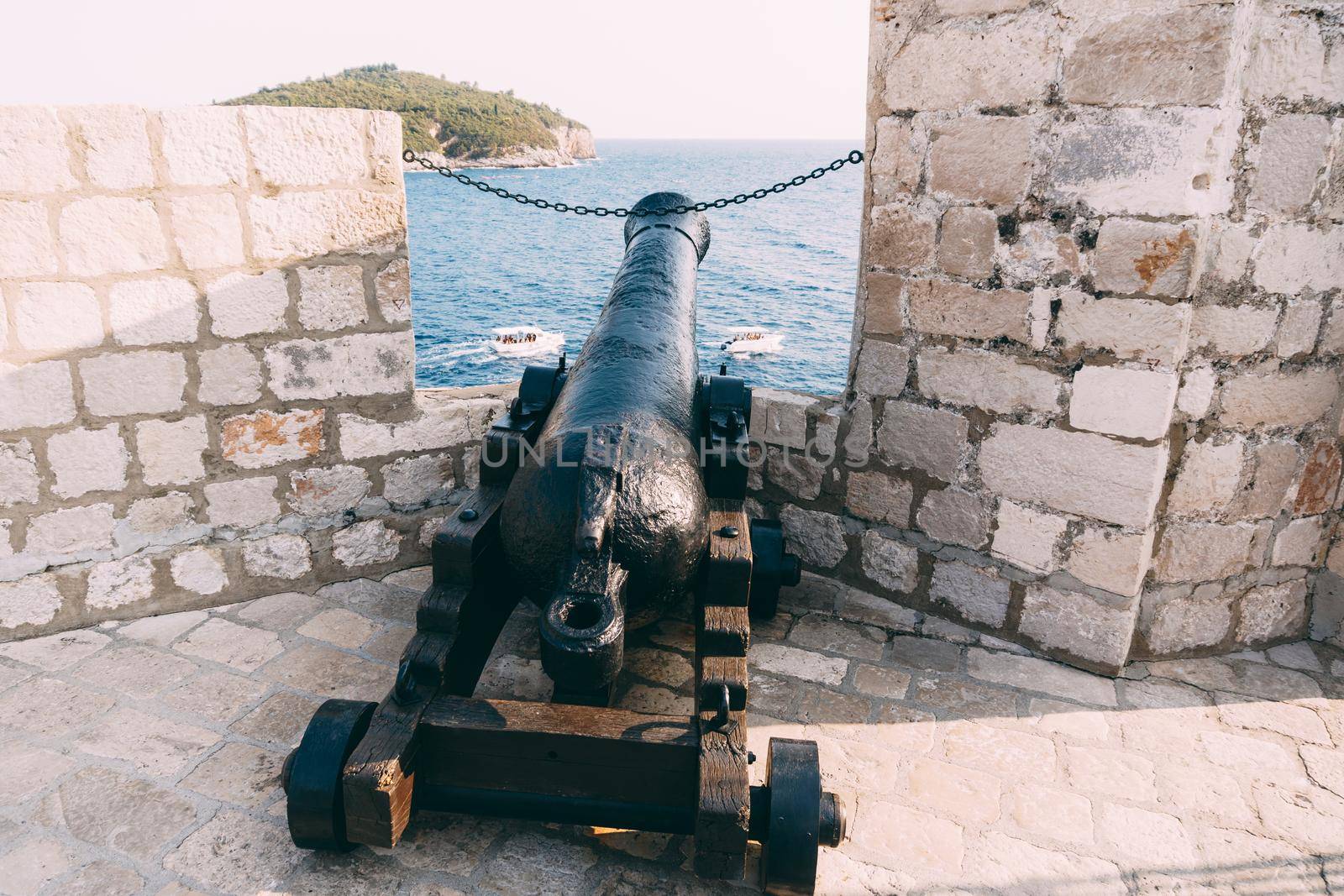 An ancient cannon with kernels on the wall of the old town of Dubrovnik in Croatia