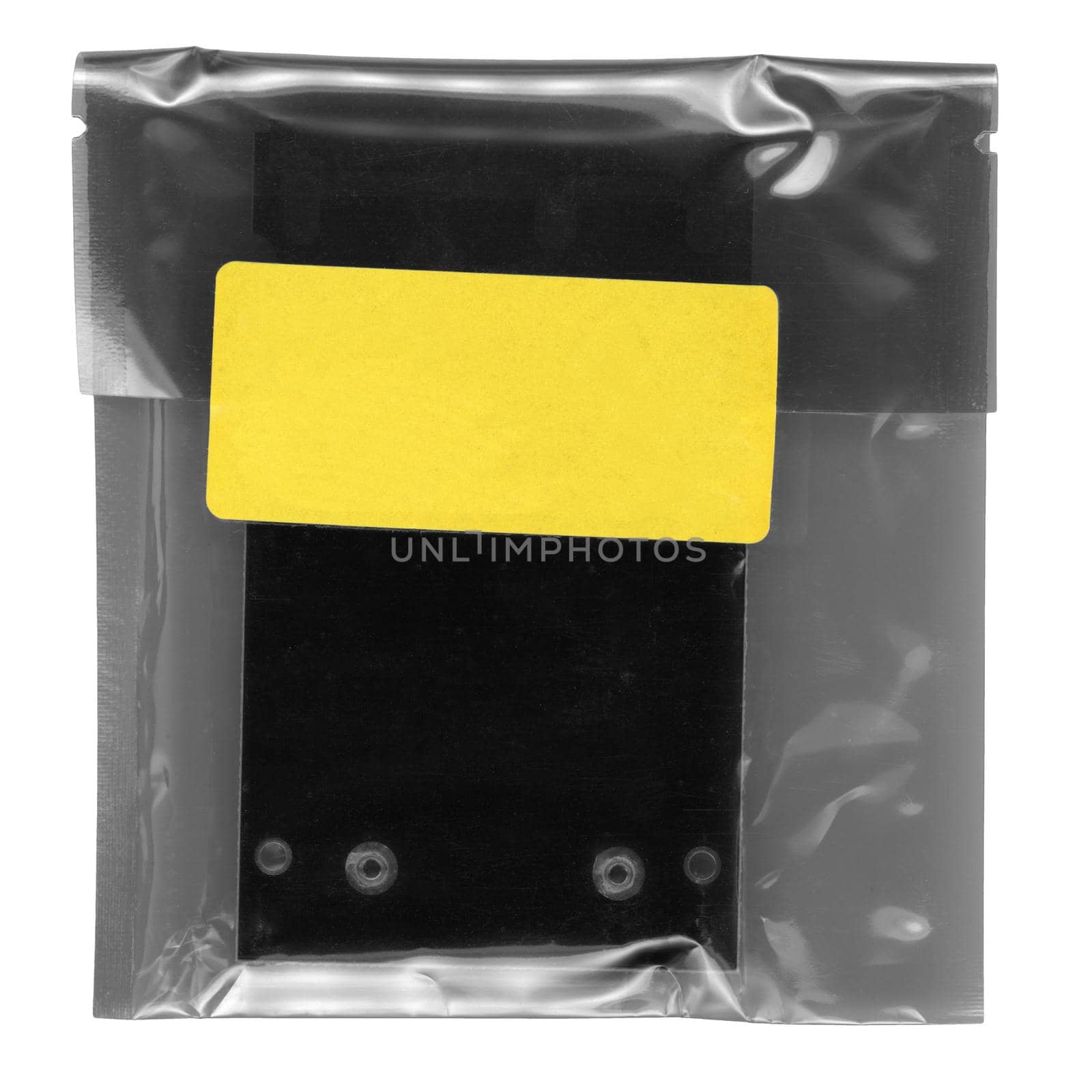 sachet with yellow paper tag label for product information isolated over white background