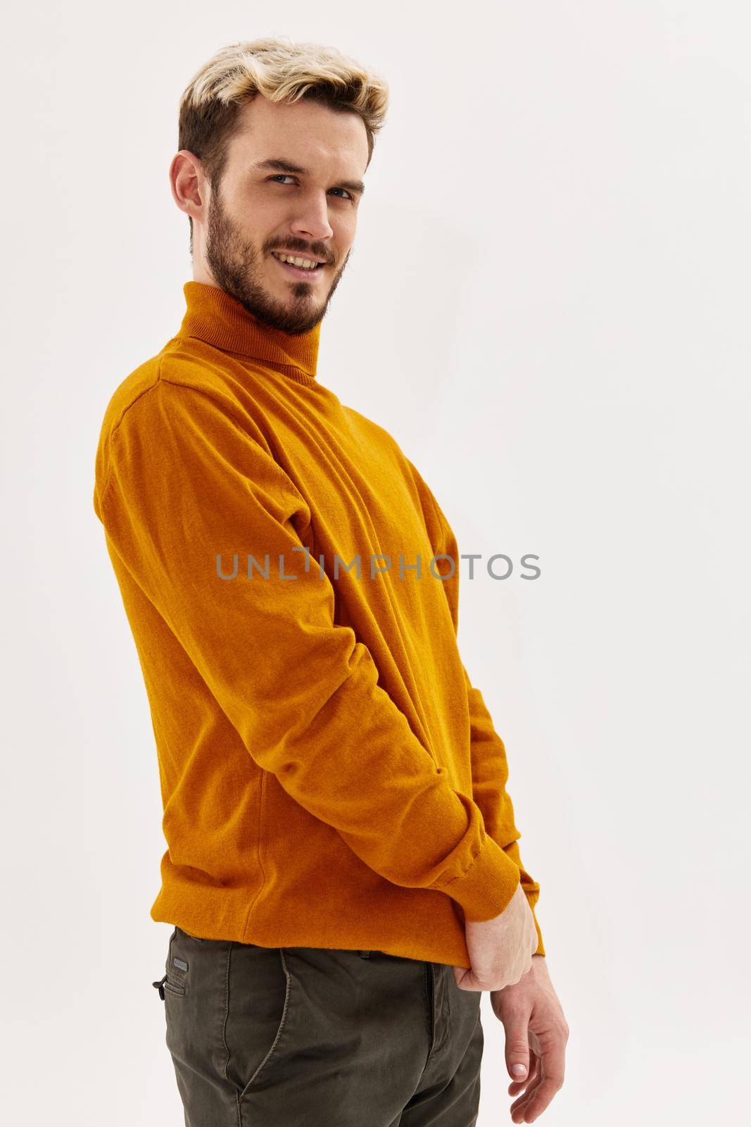 joyful man in sweater mens clothing modern style isolated background. High quality photo