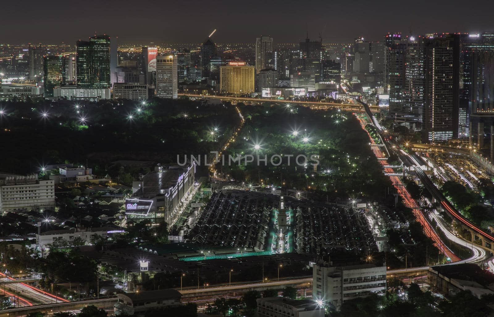Bangkok, thailand - Aug 28, 2020 : Aerial view of Bang Sue central station with skyscrapers background at night. Selective focus.