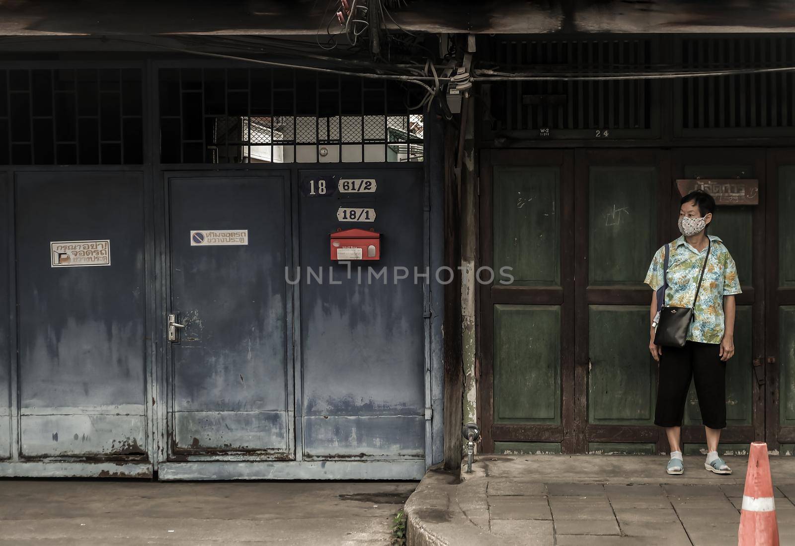 Bangkok, Thailand - July 10, 2019 : Senior woman with medical mask to protect covid-19 When leaving home. No focus, specifically.