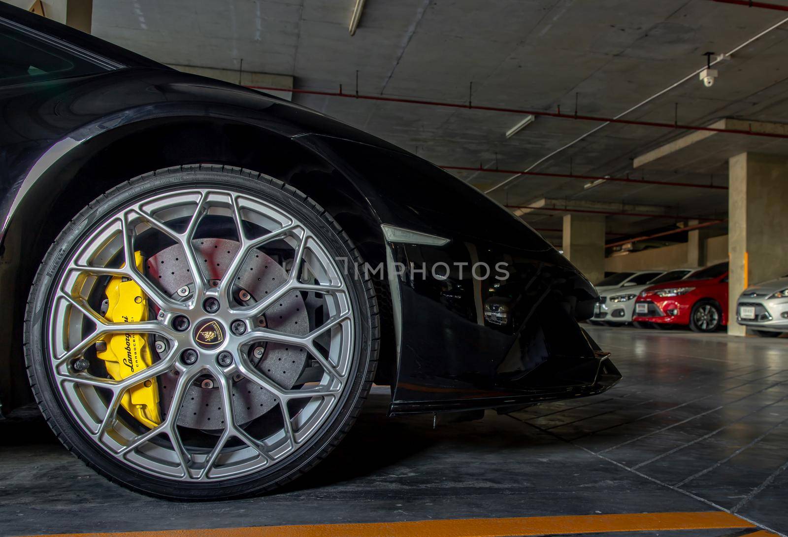 Bangkok, Thailand - 06 Jan 2021 : Close-up of Wheel of Black Lamborghini Sports Car. Lamborghini is Italian sports car. Selective focus.