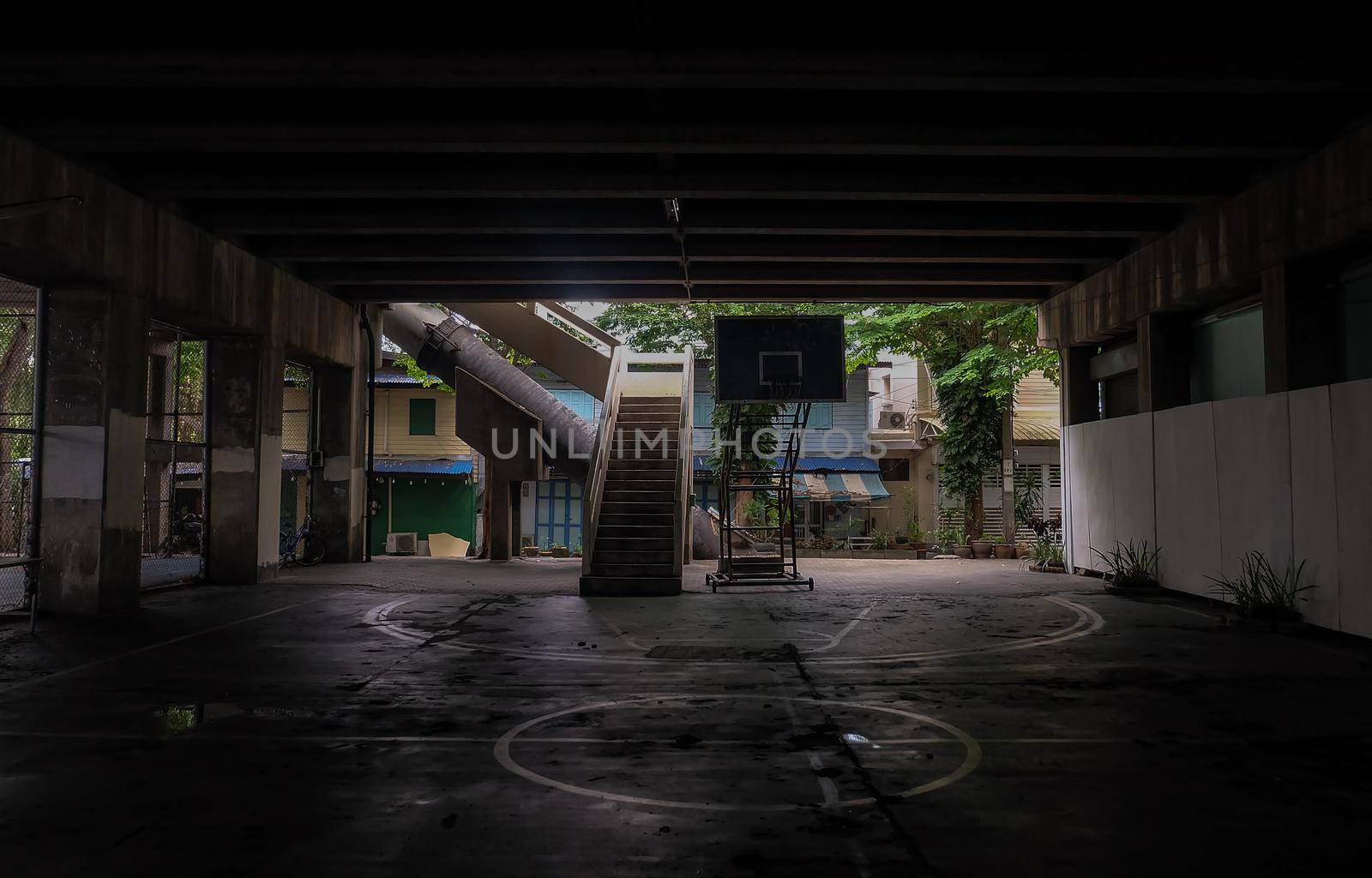 The old cement stairs leading down to the community basketball court under the bridge. No focus, specifically.
