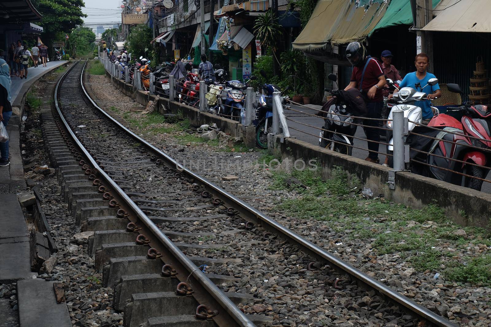 Bangkok, Thailand - July 10, 2019 : Railway tracks adjacent to the community. Transportation and travel concept. No focus, specifically.