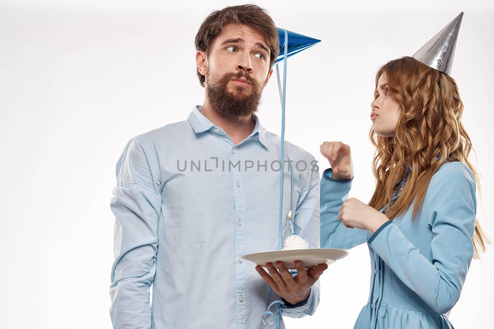 Birthday corporate young man and woman with cake on isolated background disco party by SHOTPRIME