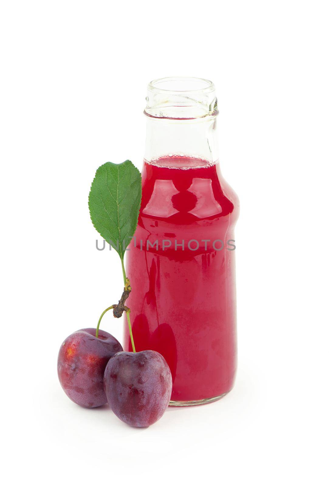 plum juice in a glass with fresh plum fruit isolated on white background.