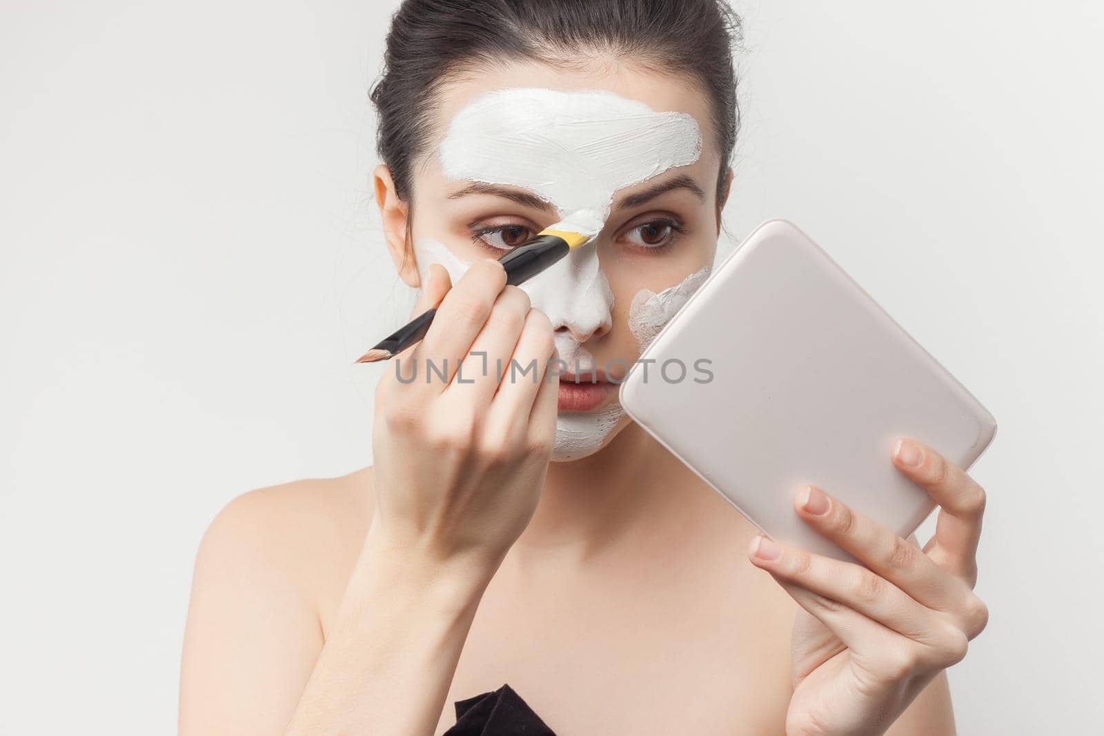 pretty brunette brush face mask skin care health. High quality photo