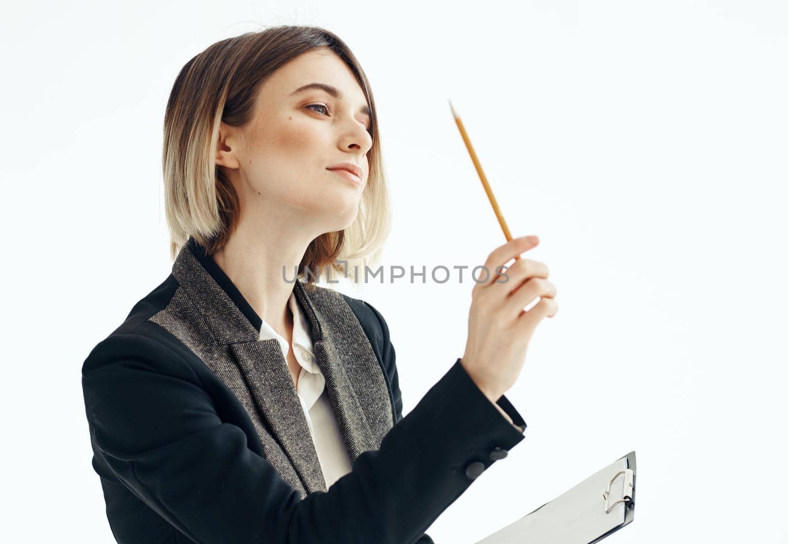 women with a pencil in their hands writes information on a light background work mode by SHOTPRIME