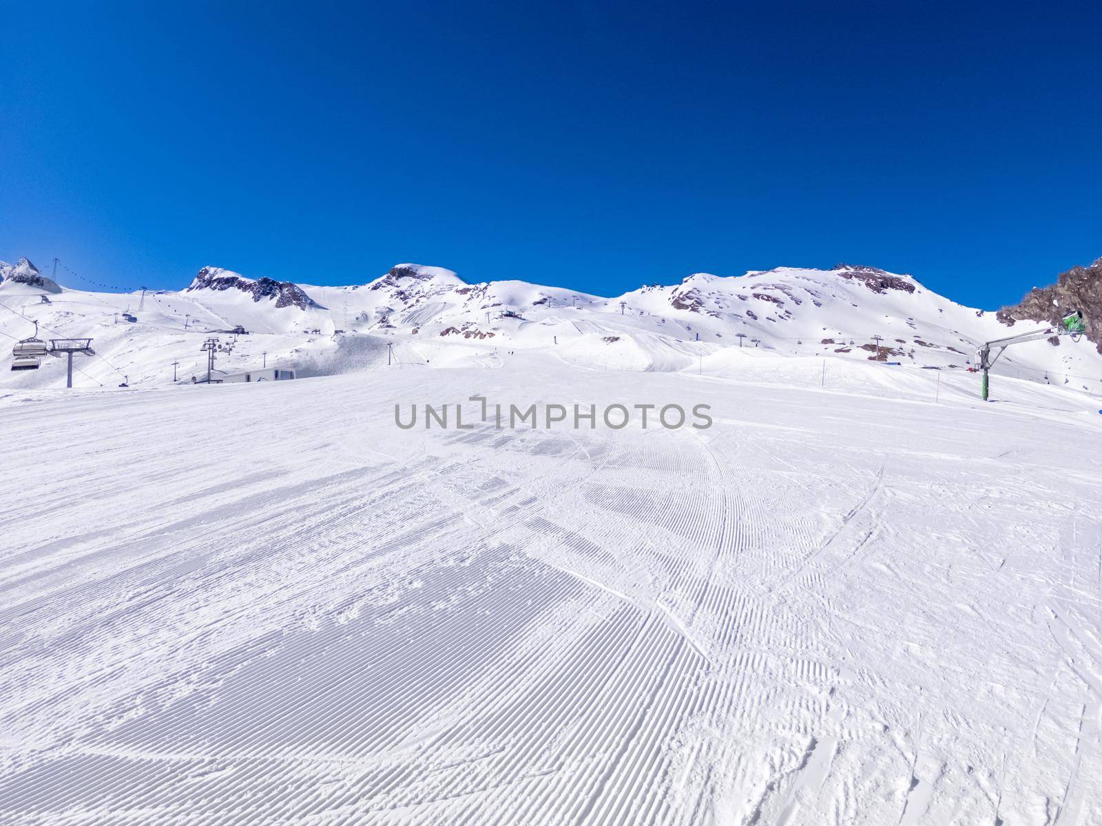 winter skiing area on a glacier with a ski slope.
