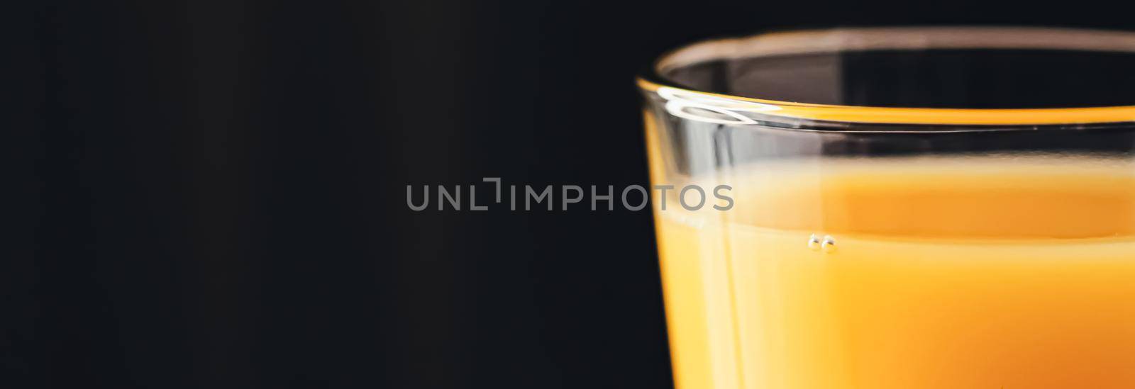 Glass of orange juice, healthy drink closeup