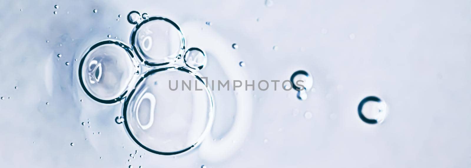 Transparent gel cream bubbles as cosmetics background, hygiene and science closeup