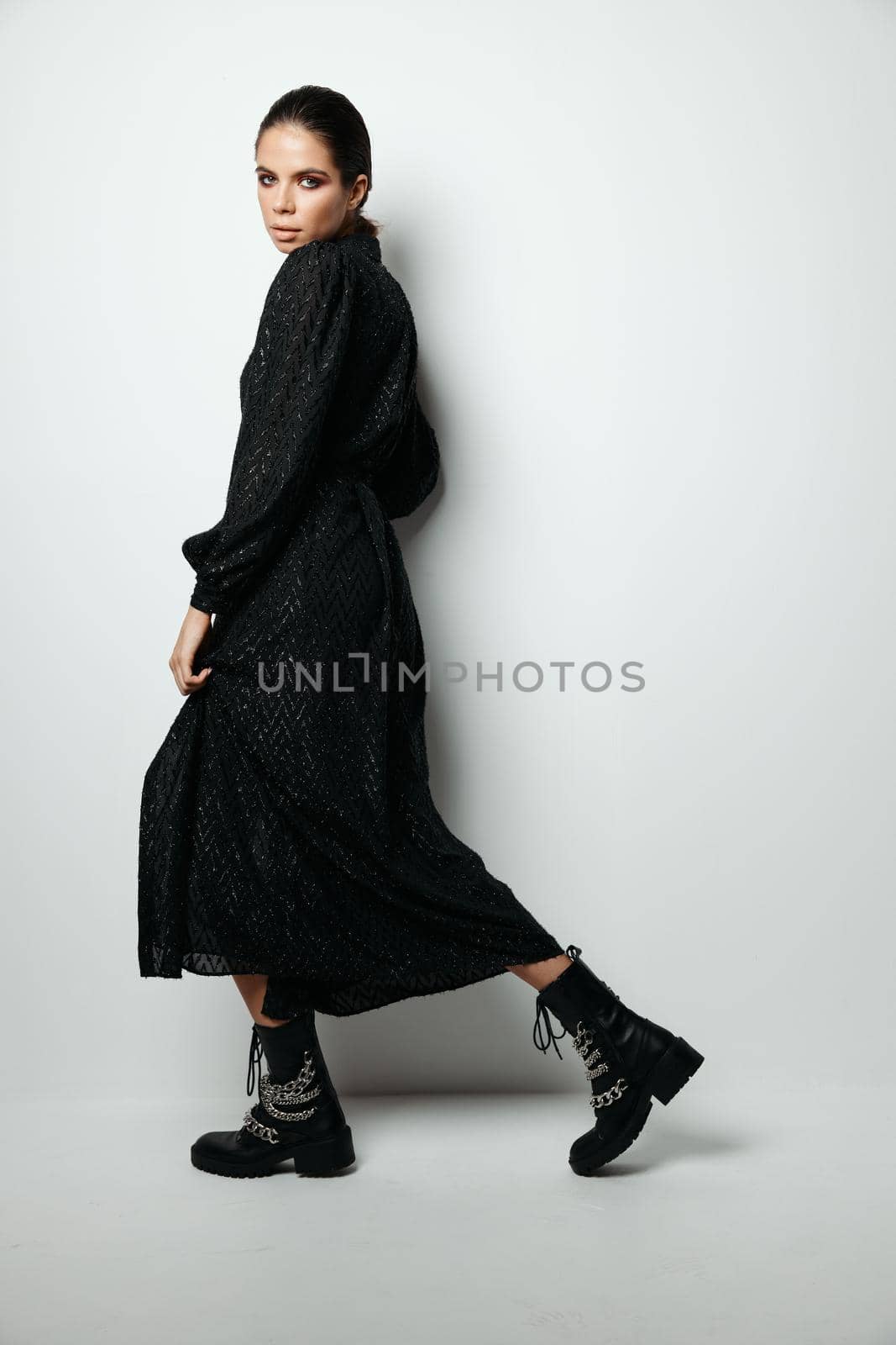 brunette bright makeup black dress glamor model. High quality photo