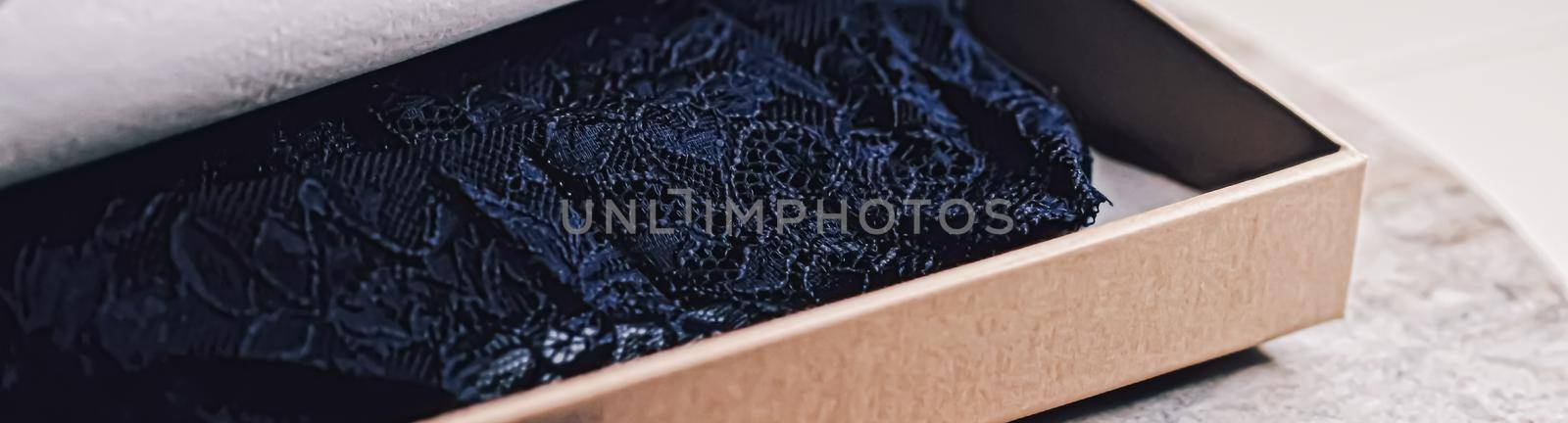 Lace garment inside elegant gift box as luxury purchase, closeup