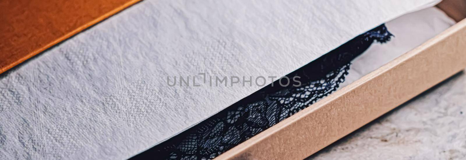 Lace garment inside elegant gift box as luxury purchase, closeup