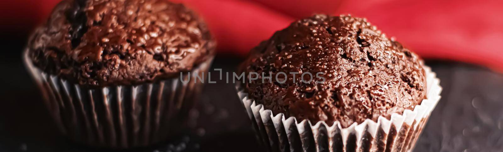 Two chocolate muffins freshly baked at home, homemade comfort food recipe concept