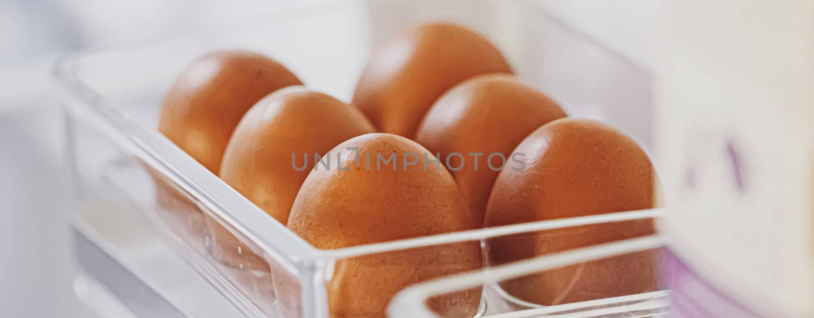 fresh eggs in refrigerator, dairy product closeup