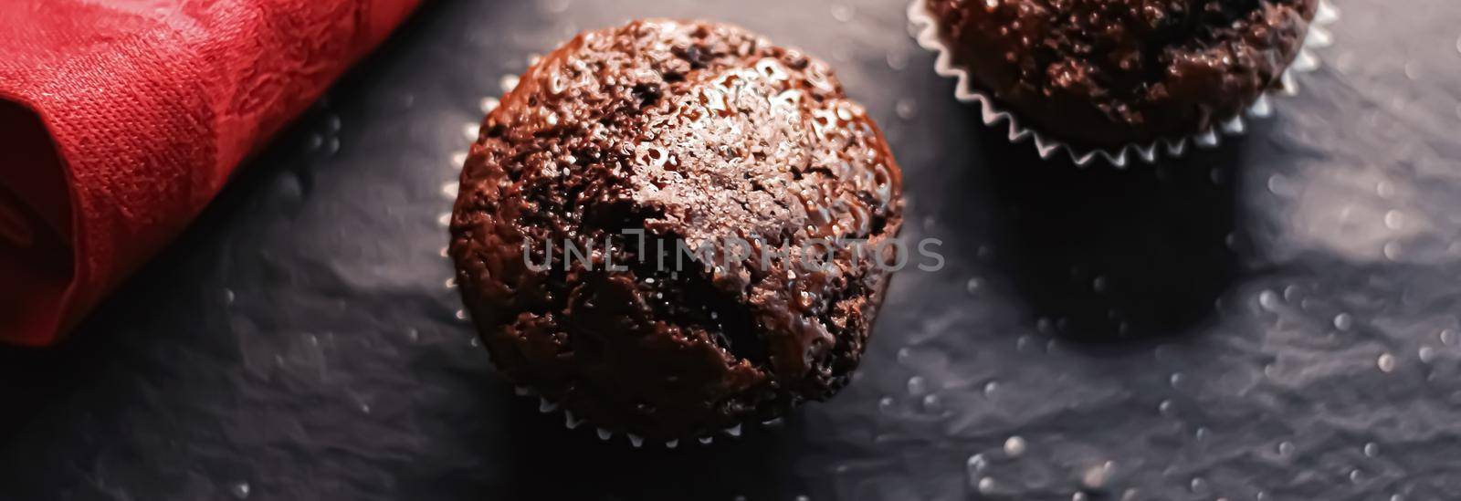 Two chocolate muffins freshly baked at home, homemade comfort food recipe concept