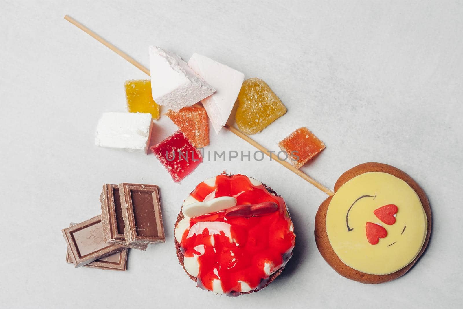 gingerbread in the form of a smiley on a stick sweets candy dessert delight snack. High quality photo