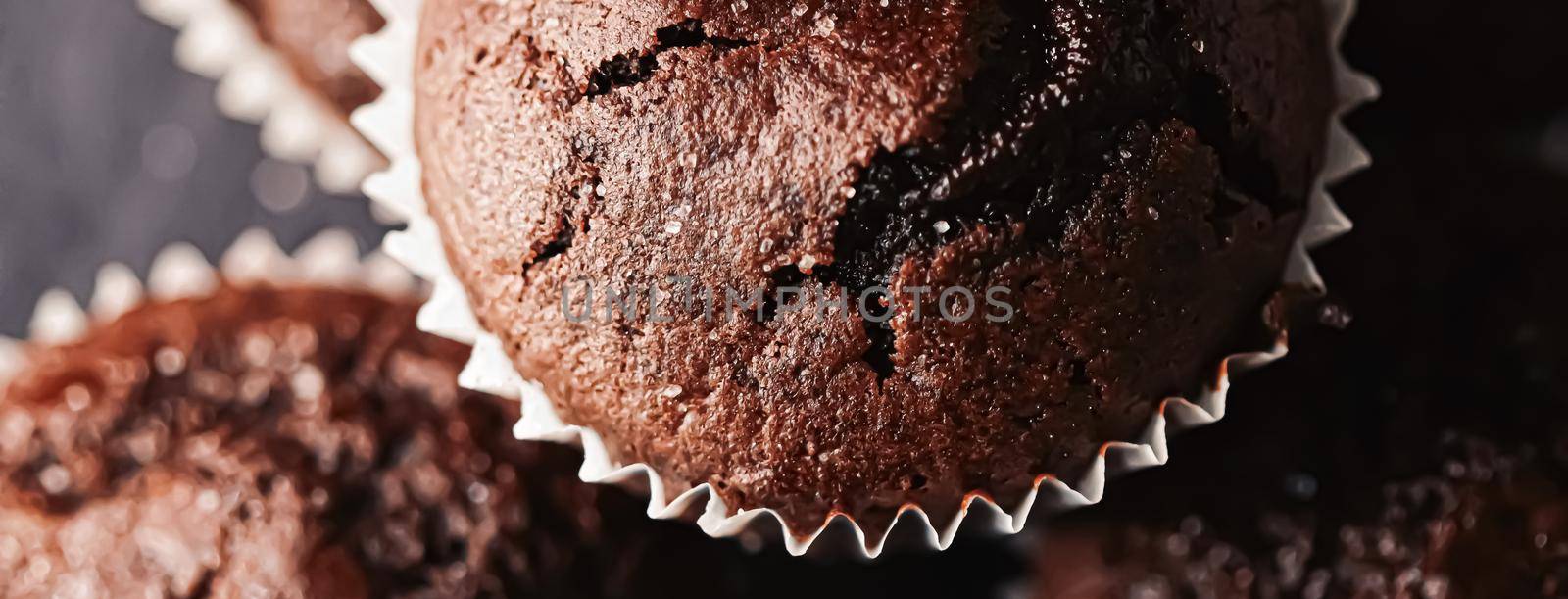 Homemade chocolate muffins, baked comfort food recipe concept