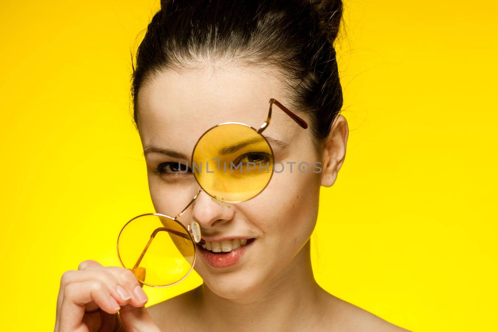 pretty woman with bare shoulders glasses in hands attractive look. High quality photo