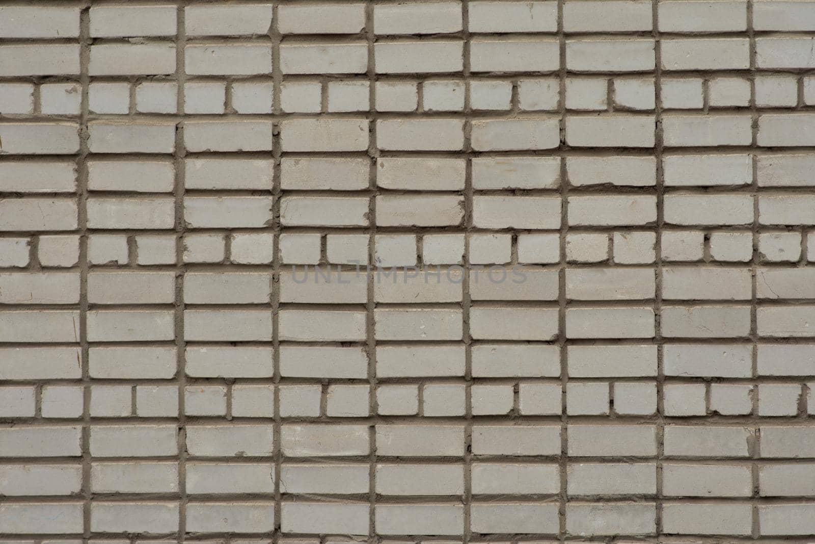 White brick wall. Part of the wall of a tall building. Texture