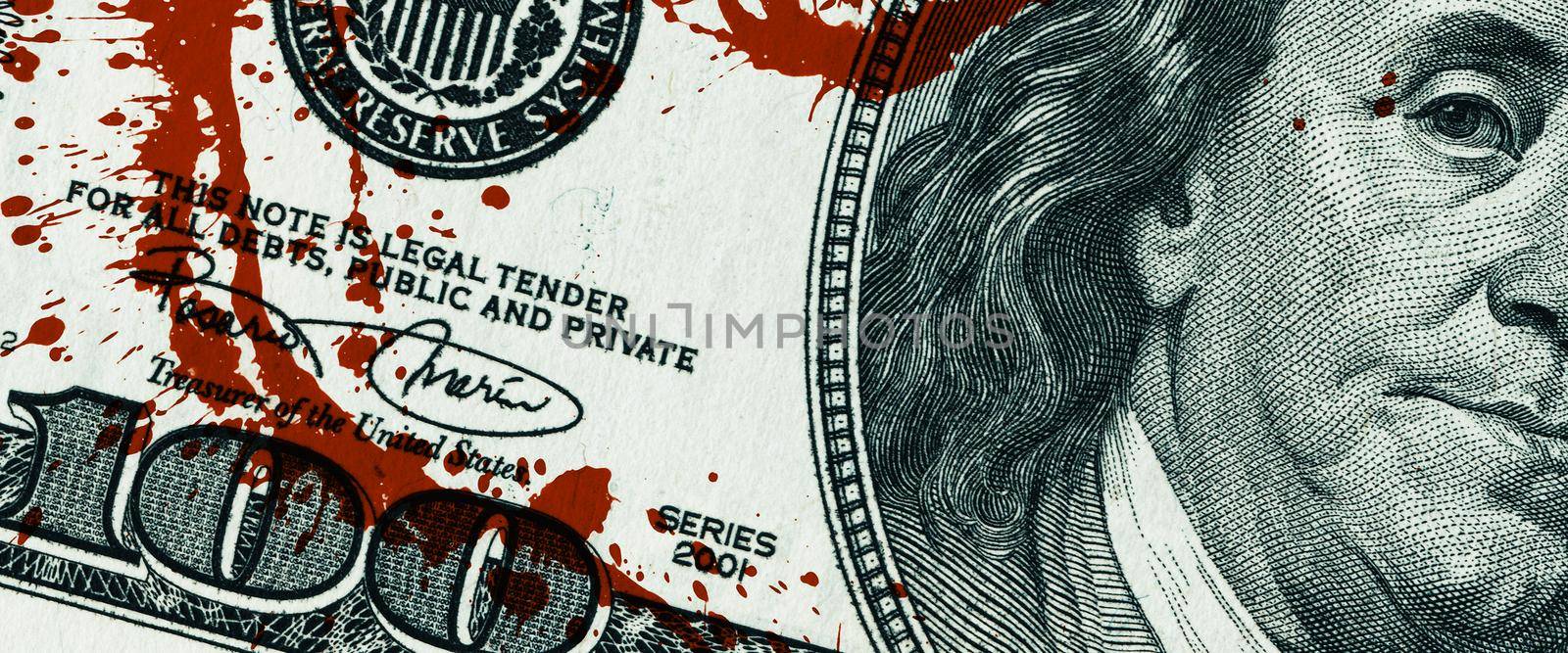 Blood money concept. Fragment of a one hundred dollar bill with blood stains