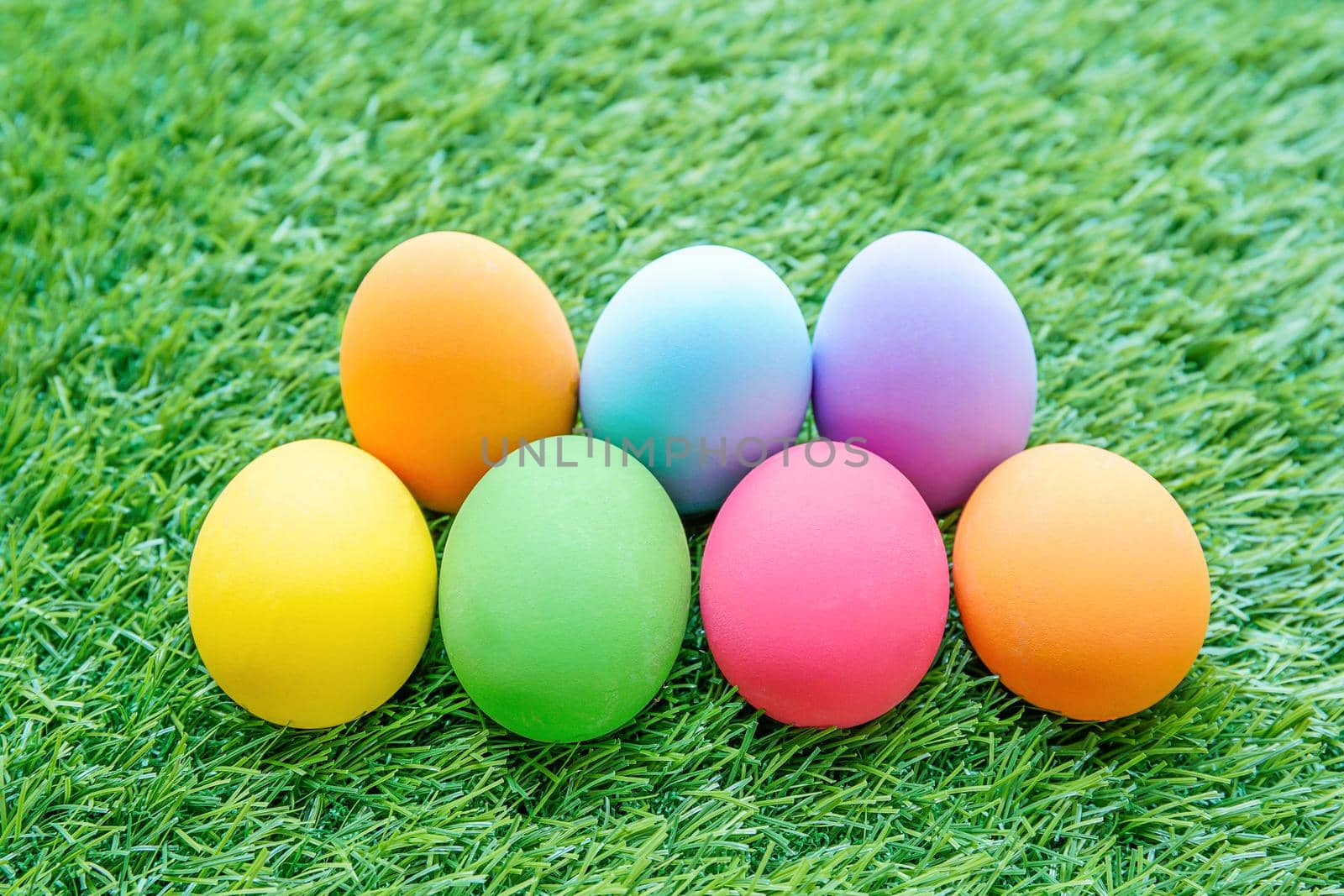 Close up Colorful easter eggs on on green gras background