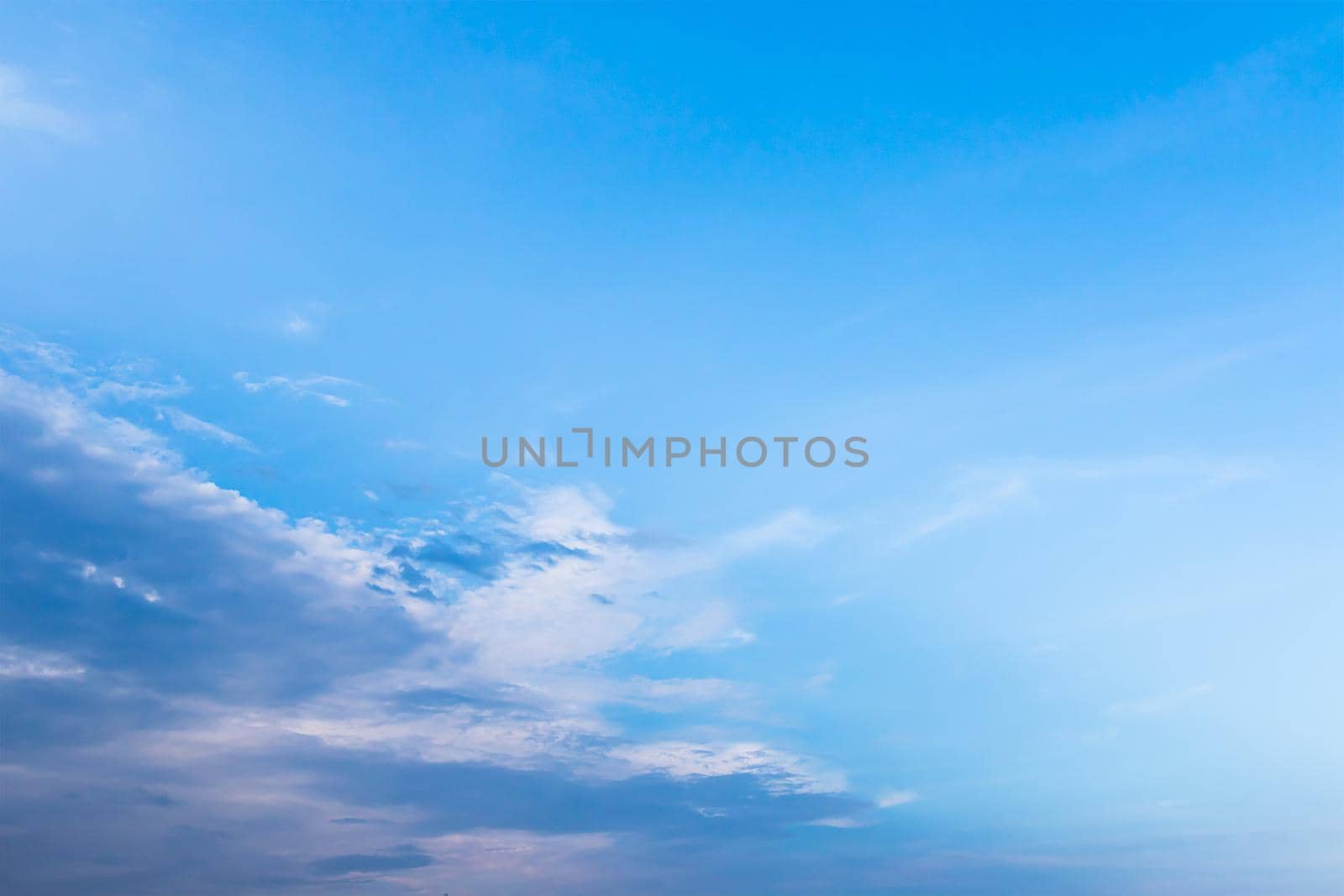 White fluffy clouds in the blue sky, Fantastic soft white clouds against blue sky