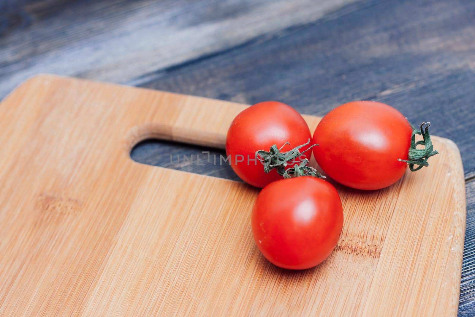 italian pasta cherry tomatoes cutting board food preparation. High quality photo