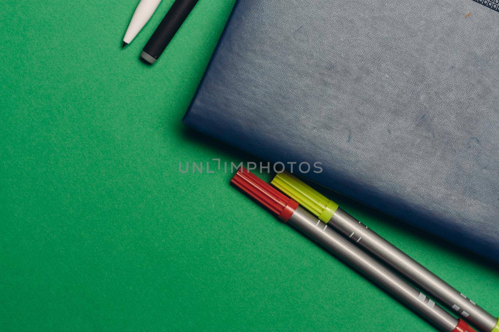 office supplies notepads pens on a bright background top view. High quality photo