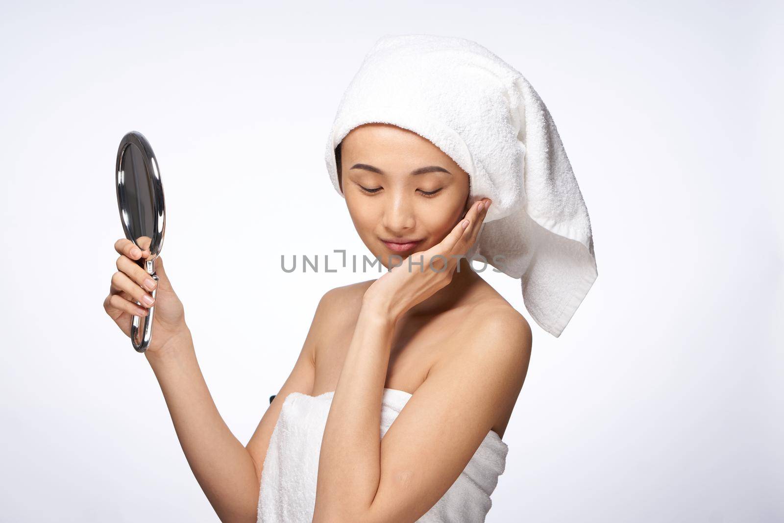 beautiful woman mirror in hands clean skin health lifestyle cosmetology. High quality photo