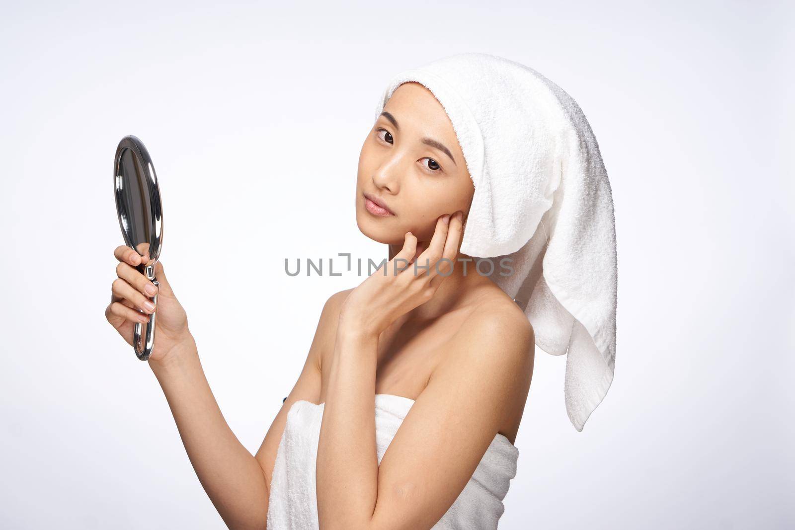 beautiful woman mirror in hands clean skin health lifestyle cosmetology. High quality photo