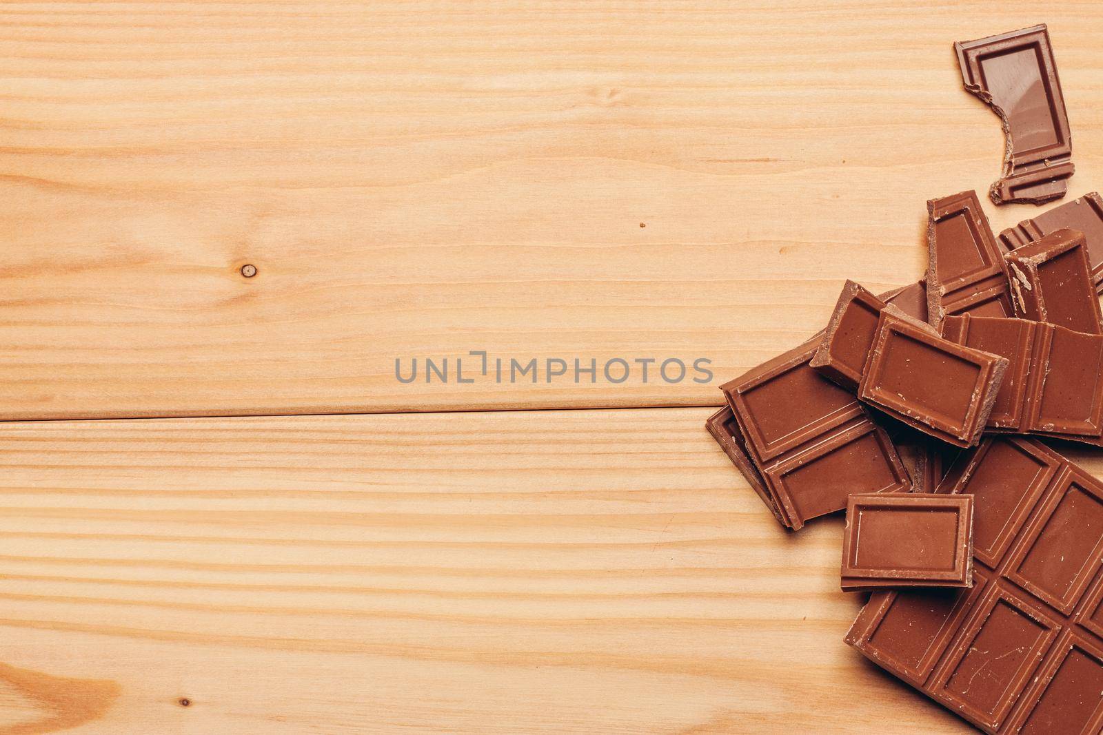 cake and chocolate bar wooden background image texture. High quality photo