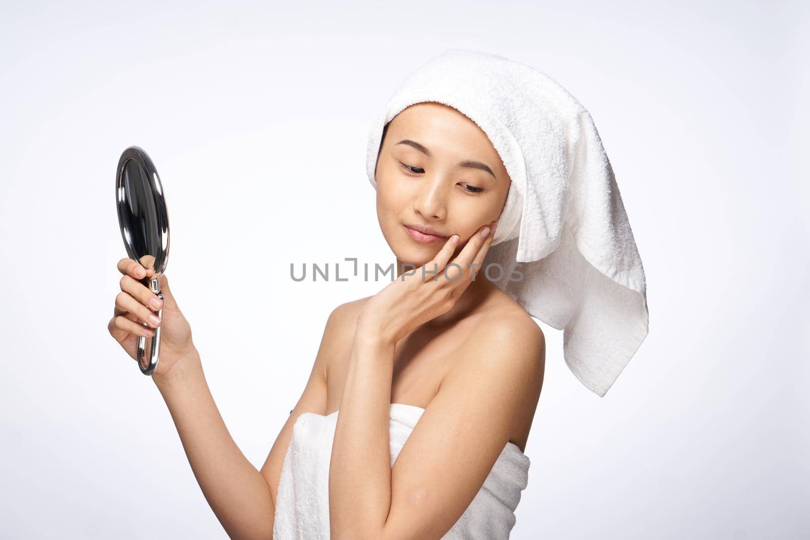 beautiful woman mirror in hands clean skin health lifestyle cosmetology. High quality photo