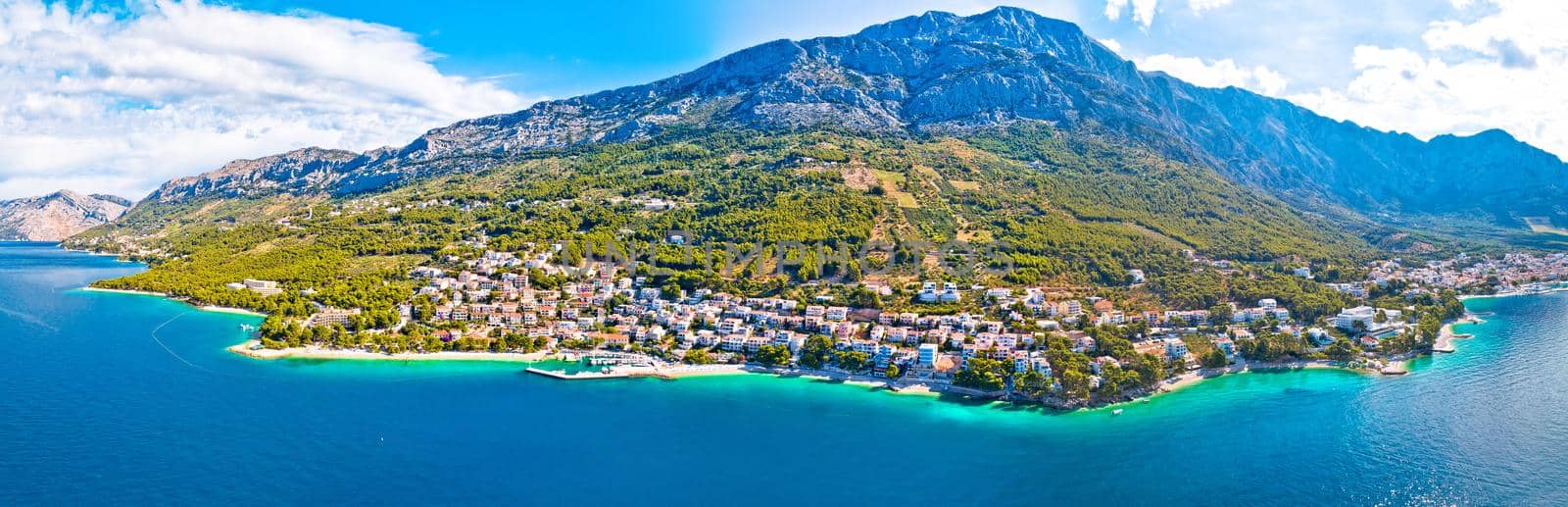 Town of Breal beach and Biokovo mountain aerial panoramic view, Makarska riviera in Dalmatia, Croatia
